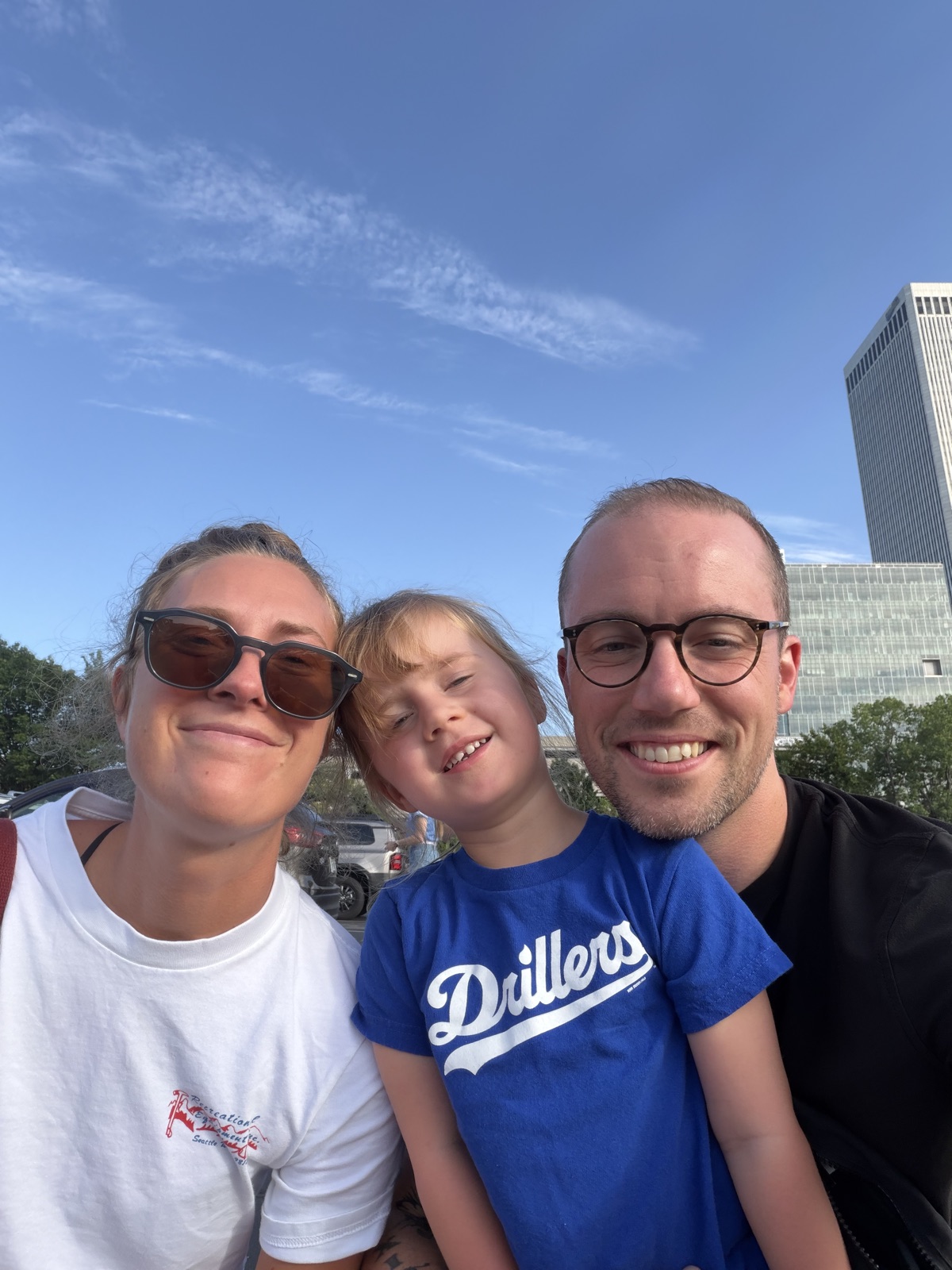 Jon with his wife and daughter at a Tulsa Drillers game